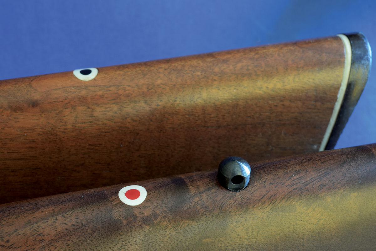 Ruger added a sling swivel stud to the stock. The red dot brings to mind Bill Ruger’s early red griffin.